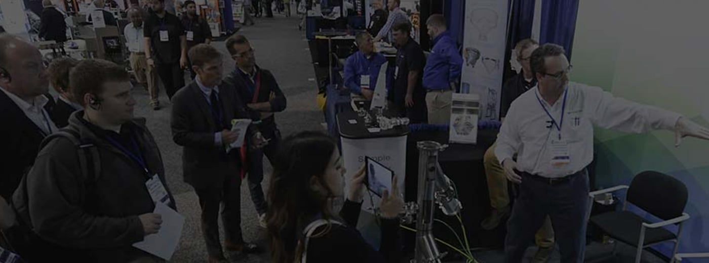 Exhibitor presenting products to group of people